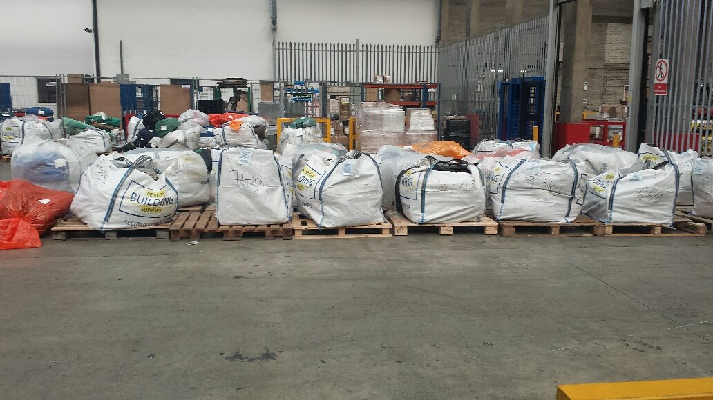 Nepal earthquake relief cargo in bulk sacks palletised at Heathrow cargo facility — Kathmandu bound, 2015